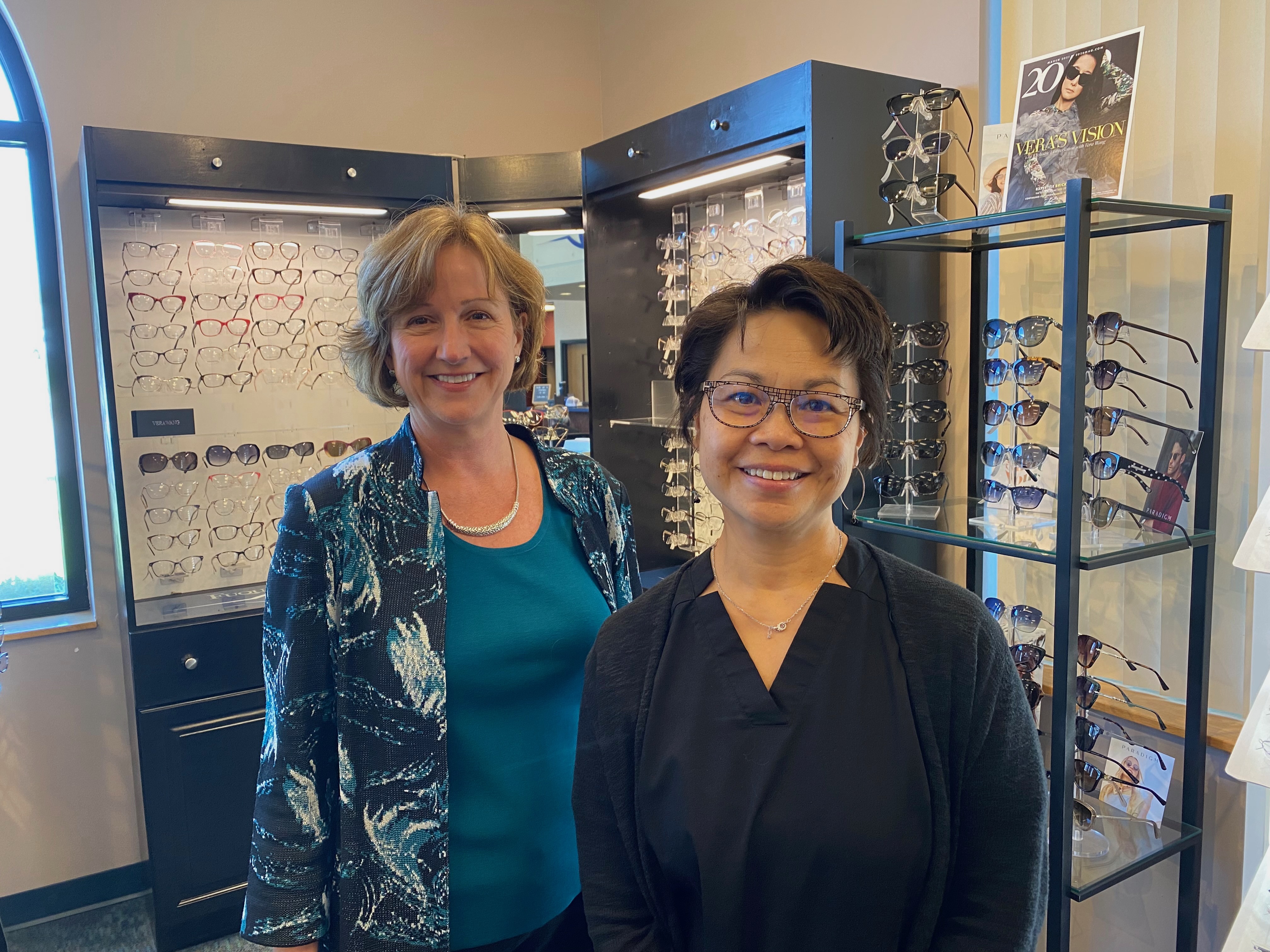 Rhonda working with an optometry staff member in clinic